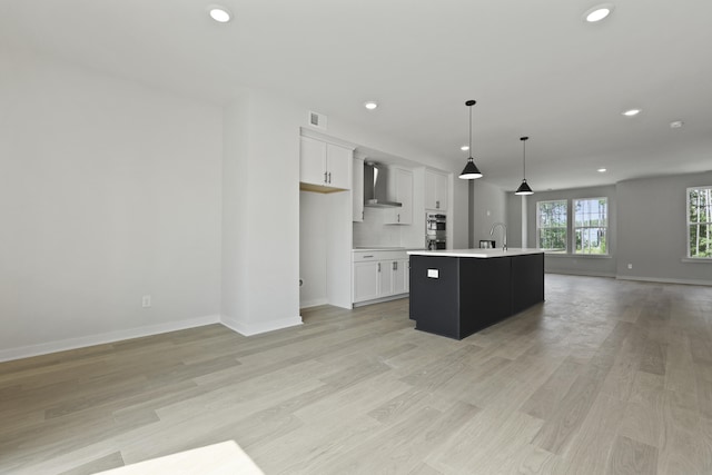 564 Scholar Way, Summerville, SC 29486 - kitchen with wall chimney exhaust hood, open floor plan, recessed lighting, light countertops, and white cabinetry
