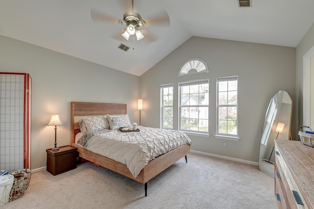 bedroom featuring a ceiling fan, visible vents, baseboards, lofted ceiling, and light colored carpet