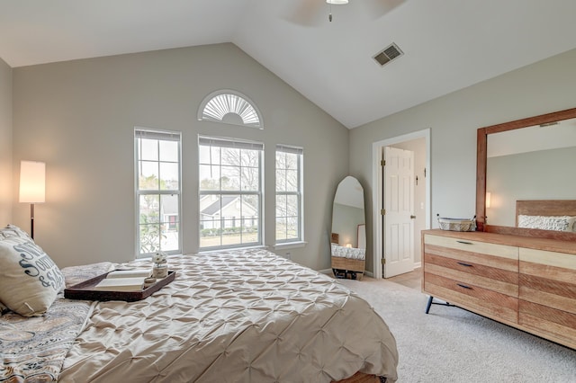 bedroom with visible vents, carpet, ceiling fan, and high vaulted ceiling