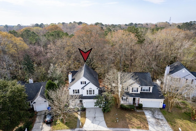 bird's eye view featuring a forest view