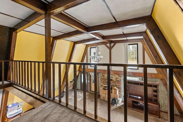 bonus room featuring vaulted ceiling with beams and a chandelier