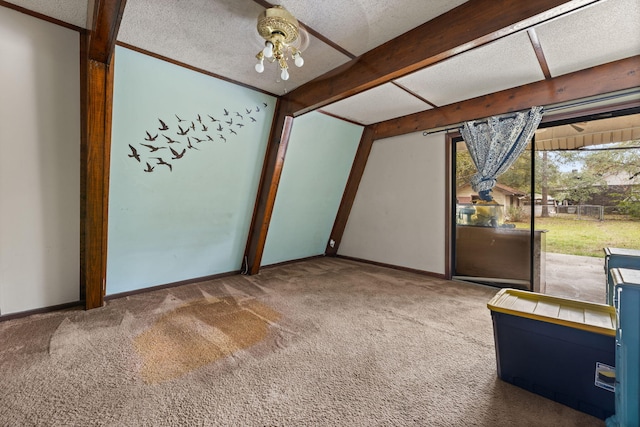 interior space featuring carpet, a textured ceiling, and a chandelier