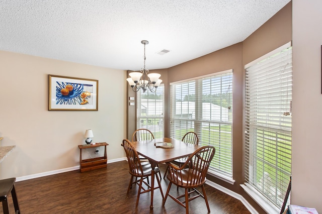 160 Syrr Run Rd, Saint George, SC 29477 - dining area with a chandelier, wood finished floors, baseboards, and a textured ceiling