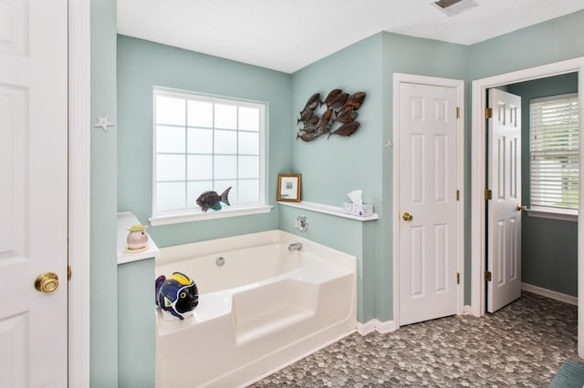 160 Syrr Run Rd, Saint George, SC 29477 - bathroom featuring a bath and baseboards