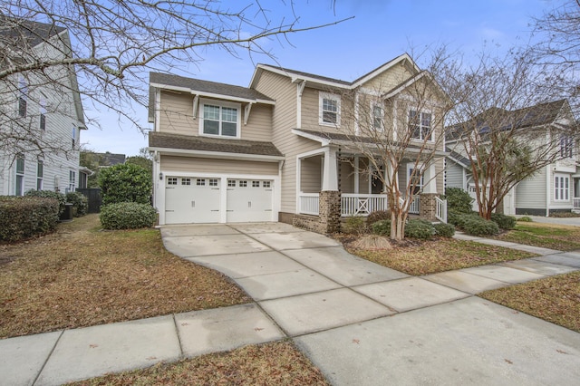 view of front of home with a porch and a garage