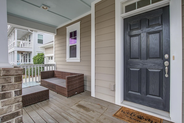 view of exterior entry featuring a porch