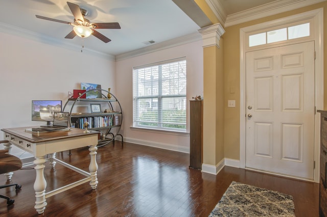 entrance foyer with ceiling fan, dark hardwood / wood-style flooring, ornamental molding, and decorative columns