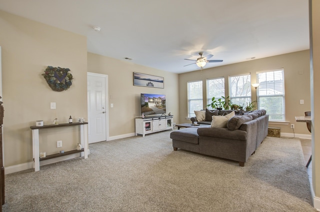 carpeted living room featuring ceiling fan