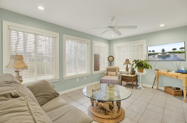 living room with light tile patterned floors, baseboards, and recessed lighting