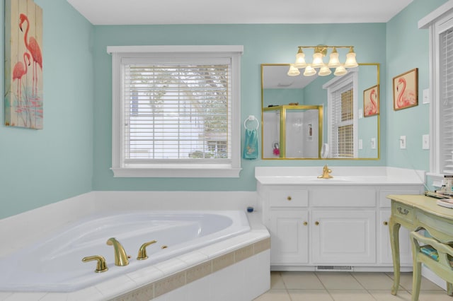 bathroom with tile patterned flooring, visible vents, vanity, a bath, and a stall shower