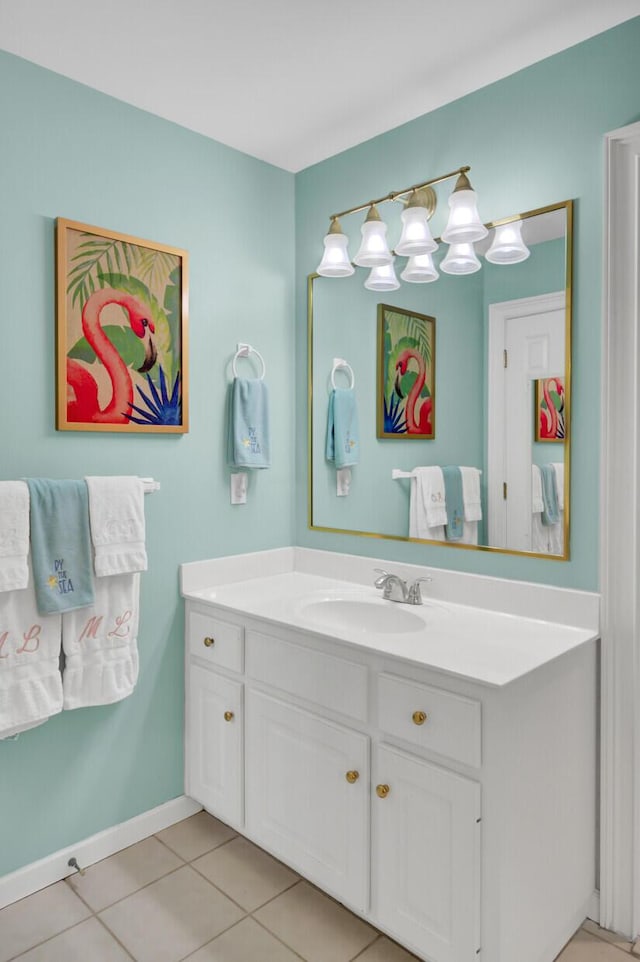 bathroom featuring baseboards, vanity, and tile patterned floors