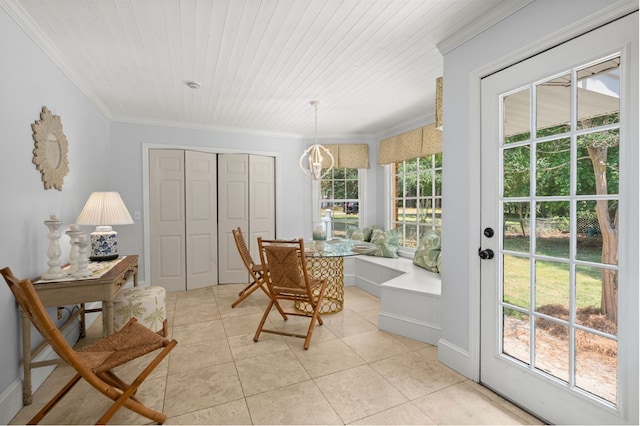 tiled dining room with crown molding, plenty of natural light, and wood ceiling