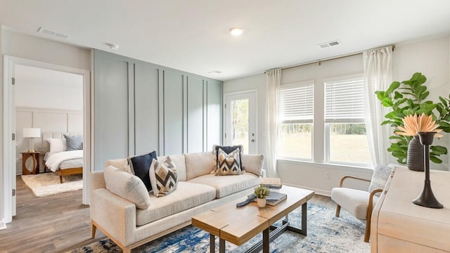 518 Golden Embers Way, Summerville, SC 29486 - living room featuring light wood-style flooring and a decorative wall