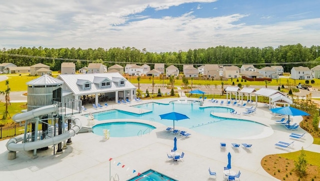518 Golden Embers Way, Summerville, SC 29486 - community pool with a water slide, a patio area, and view of wooded area