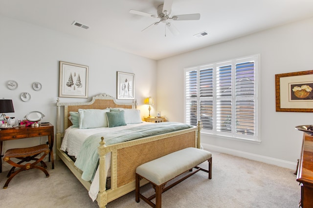 bedroom with light carpet, baseboards, visible vents, and ceiling fan