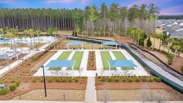 aerial view featuring a wooded view