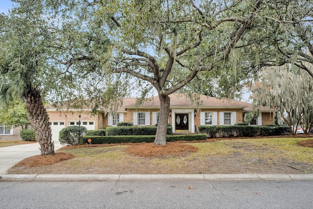 ranch-style house featuring a garage