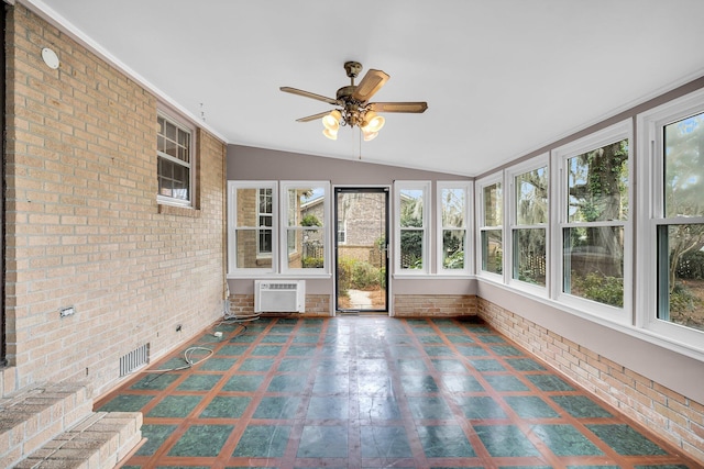 unfurnished sunroom with lofted ceiling, an AC wall unit, and ceiling fan