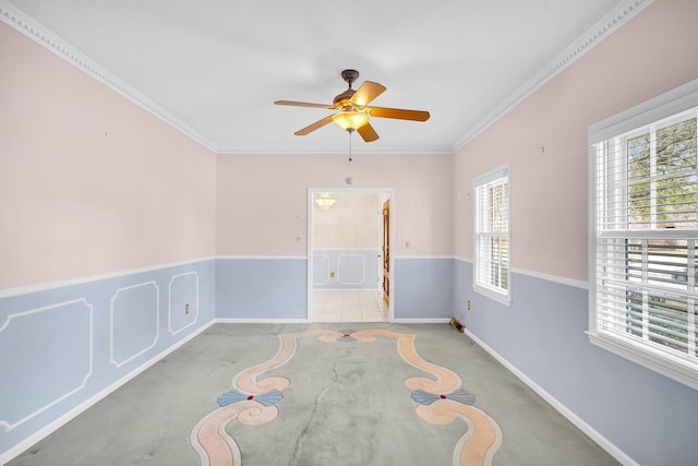 empty room with crown molding, light colored carpet, and ceiling fan