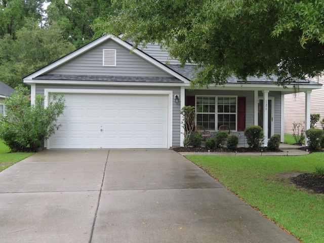 view of front facade featuring a garage and a front yard