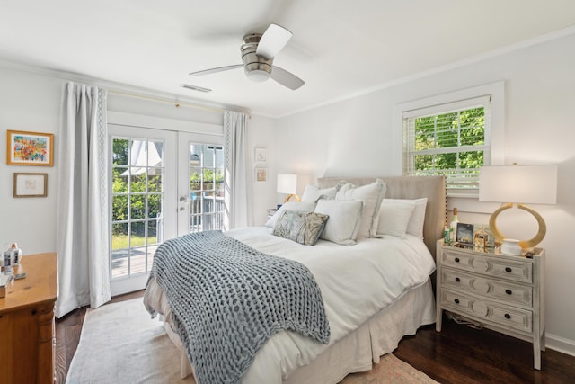 bedroom featuring access to exterior, ornamental molding, multiple windows, and french doors