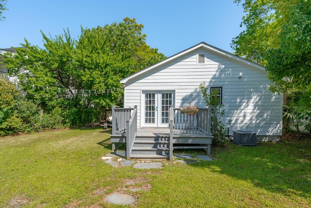 back of house featuring cooling unit, a yard, french doors, and a deck