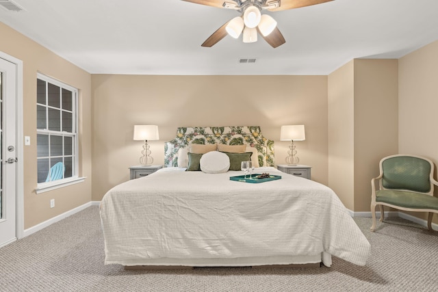 bedroom with light carpet, baseboards, visible vents, and a ceiling fan