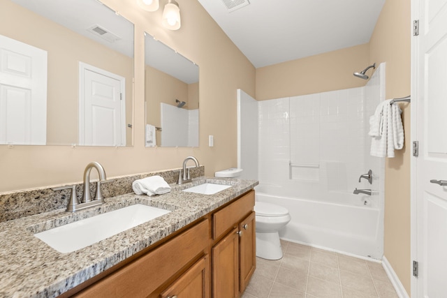 bathroom featuring tile patterned flooring, visible vents, a sink, and tub / shower combination