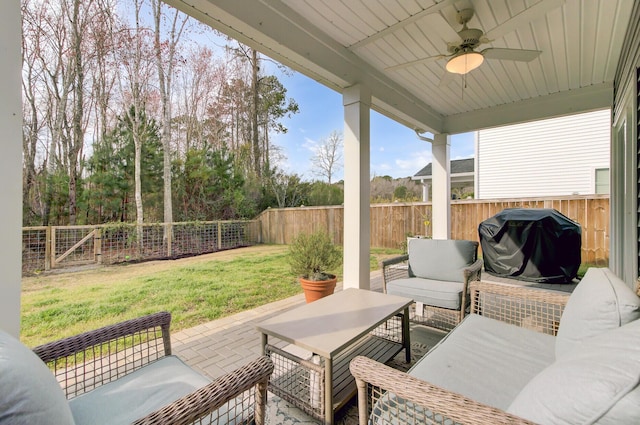 view of patio / terrace with a fenced backyard, area for grilling, outdoor lounge area, and ceiling fan