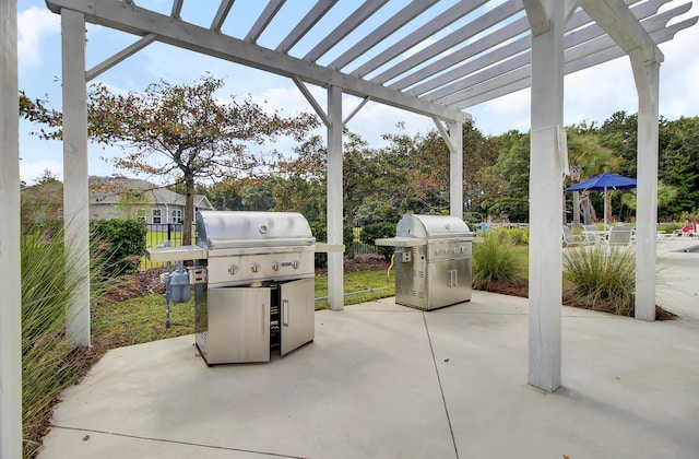 view of patio featuring fence, a pergola, and a grill