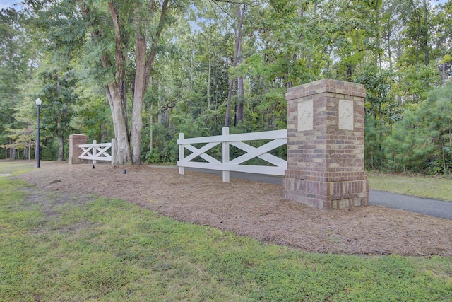 view of gate with fence