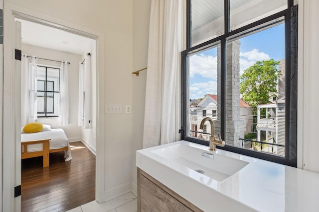 bathroom featuring baseboards and vanity