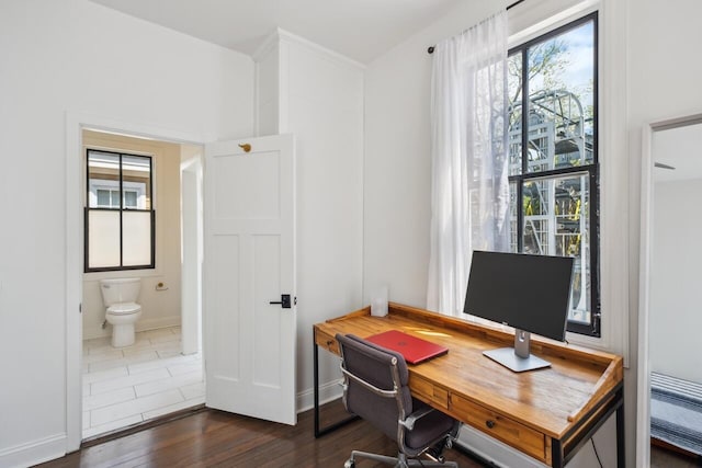 office space featuring baseboards and dark wood-style flooring