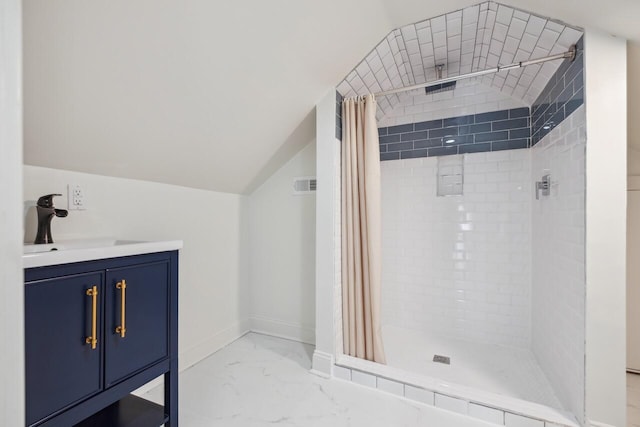 bathroom with baseboards, a shower stall, a sink, and marble finish floor