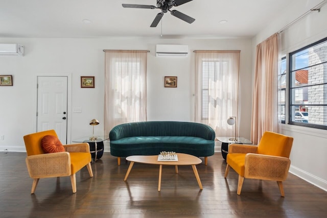 sitting room with a wall mounted AC, dark wood-style floors, a wall mounted air conditioner, and a wealth of natural light