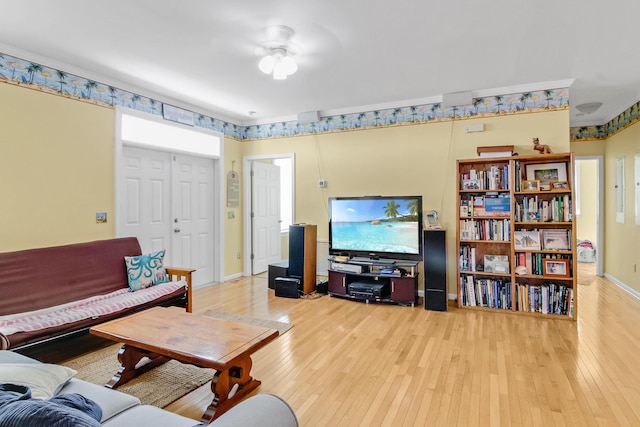 living room with baseboards and wood-type flooring