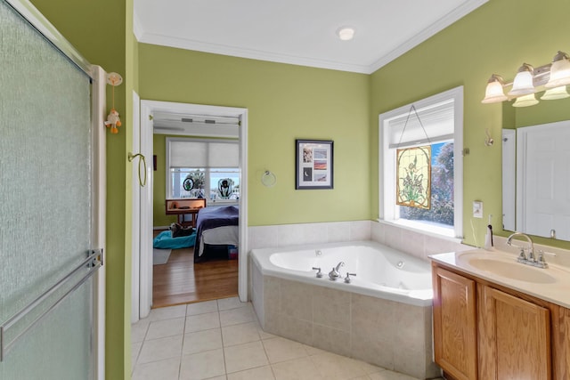 ensuite bathroom featuring ornamental molding, a jetted tub, ensuite bath, tile patterned flooring, and vanity