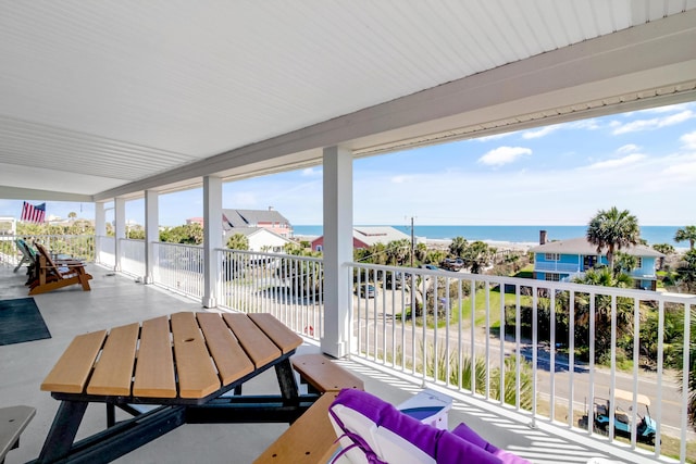 sunroom with a water view and plenty of natural light