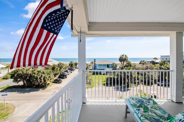 balcony featuring a water view