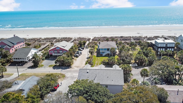 aerial view with a water view and a view of the beach