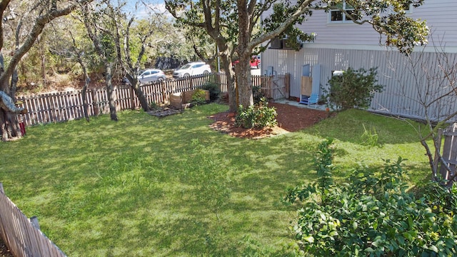 view of yard with a fenced backyard