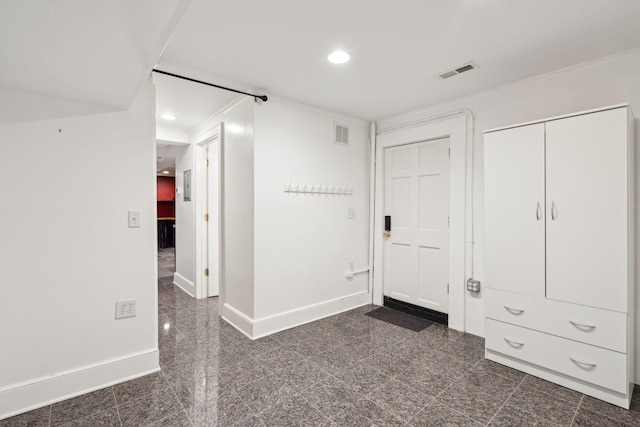 unfurnished bedroom featuring crown molding