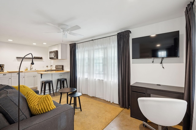 living room with ceiling fan