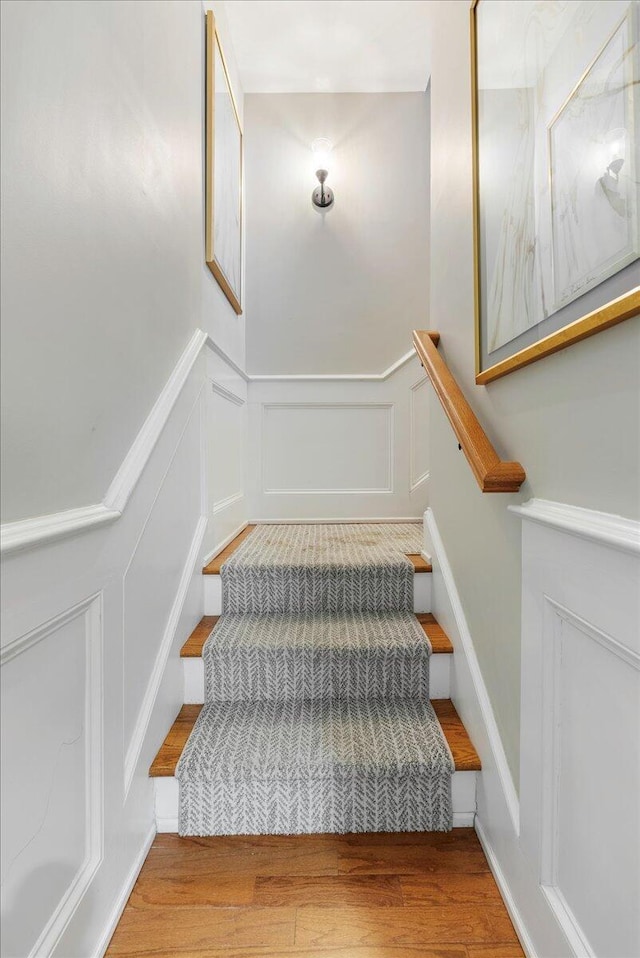 staircase featuring hardwood / wood-style flooring