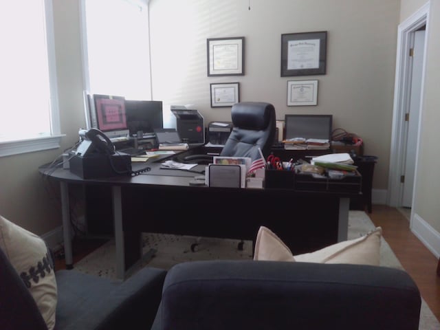 office space with light hardwood / wood-style flooring