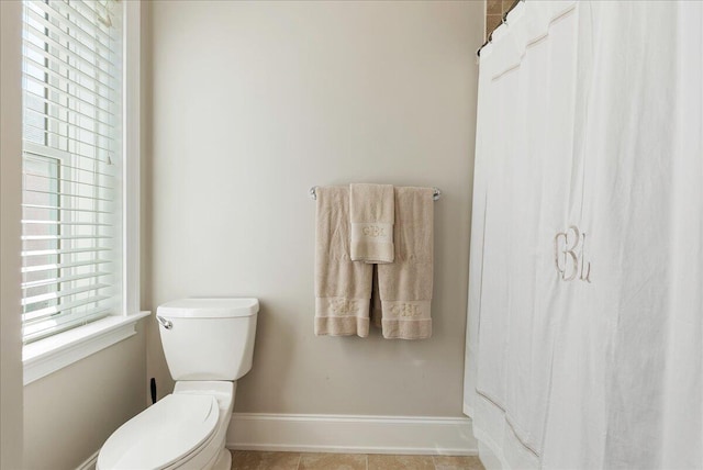 bathroom featuring tile patterned floors and toilet