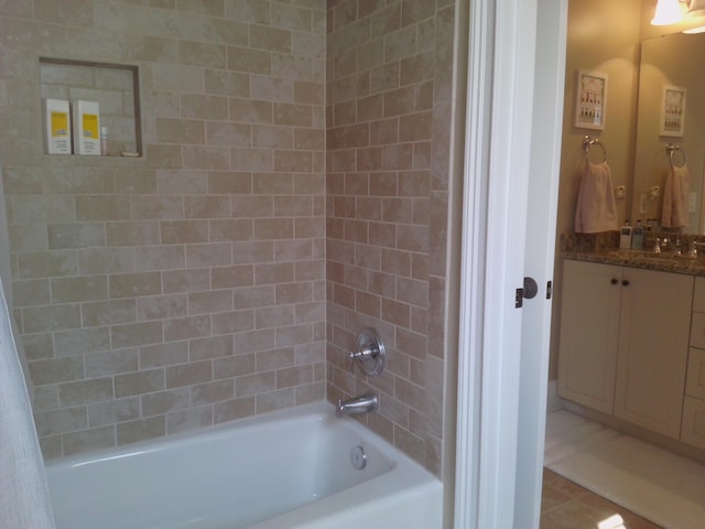 bathroom featuring vanity, tile patterned flooring, and shower / bath combo