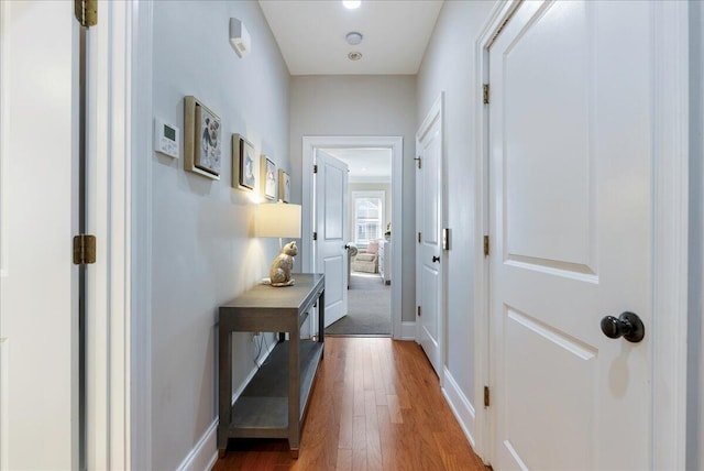 hallway featuring hardwood / wood-style flooring