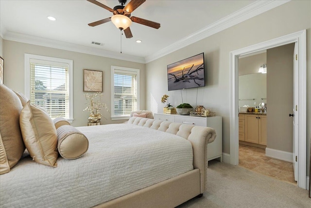 carpeted bedroom featuring ornamental molding, ceiling fan, and ensuite bath