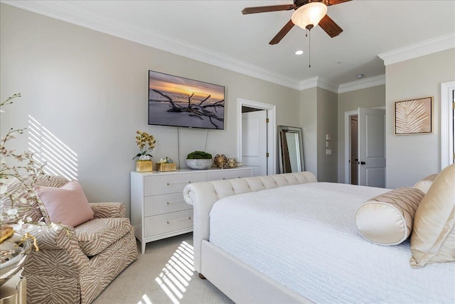 bedroom featuring light carpet, ornamental molding, and ceiling fan